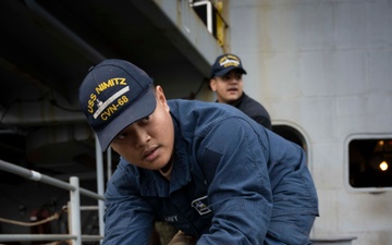 Nimitz Sailor Heaves Around Line