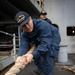 Nimitz Sailor Heaves Around Line