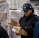 USS Ronald Reagan (CVN 76) Sailors issue personal protective equipment