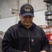 USS Ronald Reagan (CVN 76) Sailors issue personal protective equipment