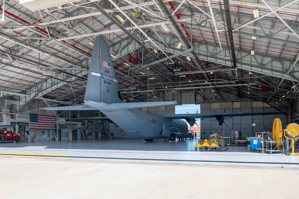 C-130J towed into hangar