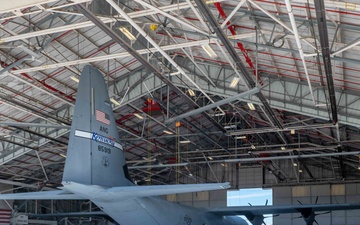 C-130J towed into hangar