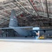 C-130J towed into hangar