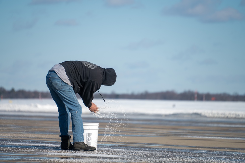 Joint Base Andrews team clears ice, snow ahead of state funeral arrival ceremony