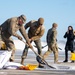 Joint Base Andrews team clears ice, snow ahead of state funeral arrival ceremony