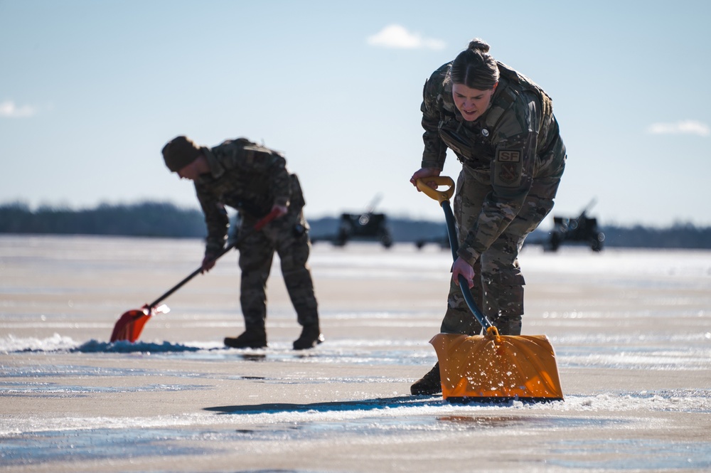 Joint Base Andrews team clears ice, snow ahead of state funeral arrival ceremony