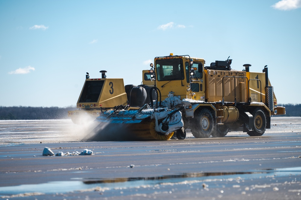 Joint Base Andrews team clears ice, snow ahead of state funeral arrival ceremony