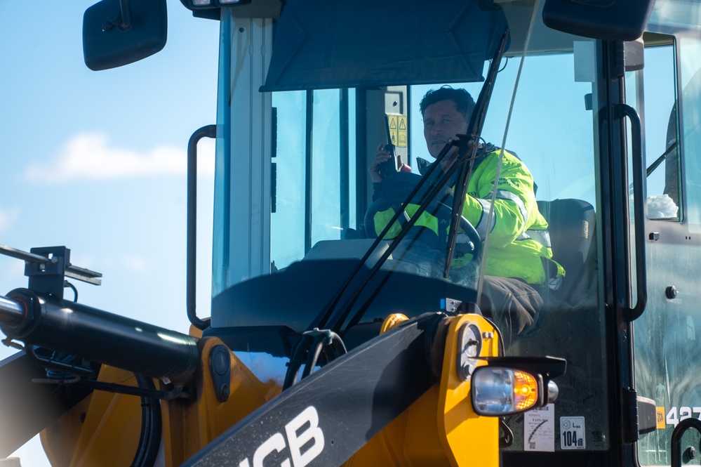 Joint Base Andrews team clears ice, snow ahead of state funeral arrival ceremony