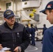 USS Ronald Reagan (CVN 76) Sailors issue personal protective equipment