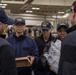 USS Ronald Reagan (CVN 76) Sailors issue personal protective equipment