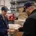 USS Ronald Reagan (CVN 76) Sailors issue personal protective equipment