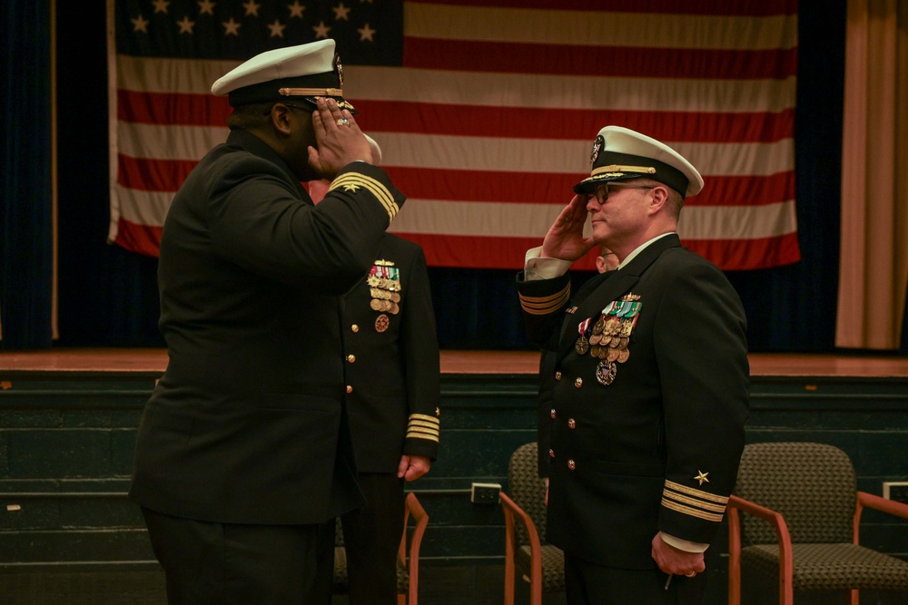 U.S. Navy Cmdr. James Koffi relieves U.S. Navy Cmdr. Chance Smith as commanding officer of USS Truxtun (DDG 103)