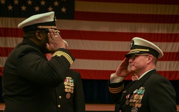 U.S. Navy Cmdr. James Koffi relieves U.S. Navy Cmdr. Chance Smith as commanding officer of USS Truxtun (DDG 103)