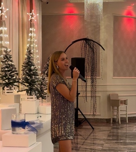 Beth Archer Perfoming at the USNMRTC Holiday Party