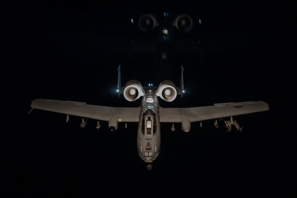 A-10 Thunderbolt II aircraft refuel with KC-135 Stratotanker at night