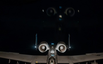 A-10 Thunderbolt II aircraft refuel with KC-135 Stratotanker at night