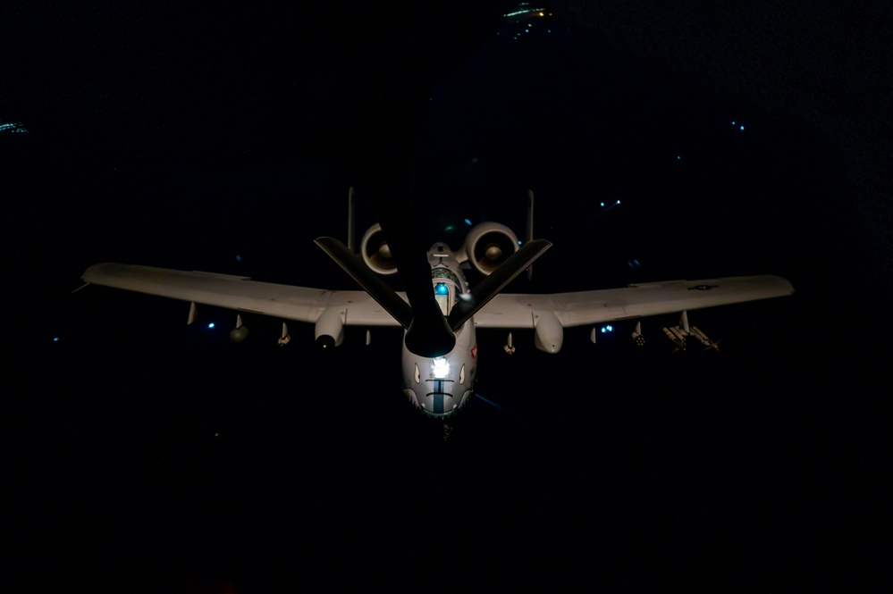 A-10 Thunderbolt II aircraft refuel with KC-135 Stratotanker at night