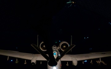 A-10 Thunderbolt II aircraft refuel with KC-135 Stratotanker at night