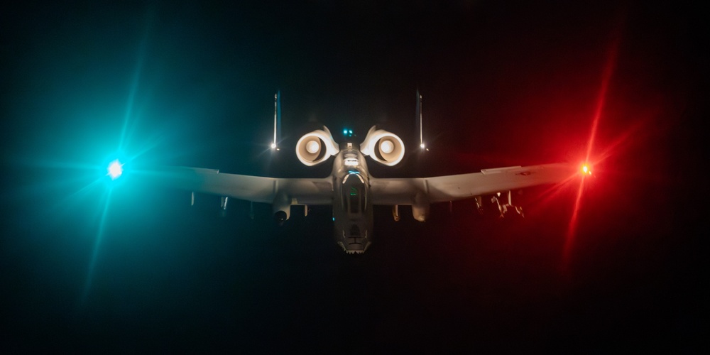 A-10 Thunderbolt II aircraft refuel with KC-135 Stratotanker at night