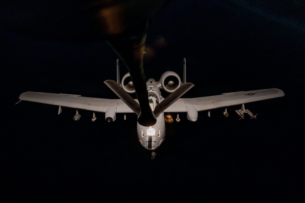 A-10 Thunderbolt II aircraft refuel with KC-135 Stratotanker at night