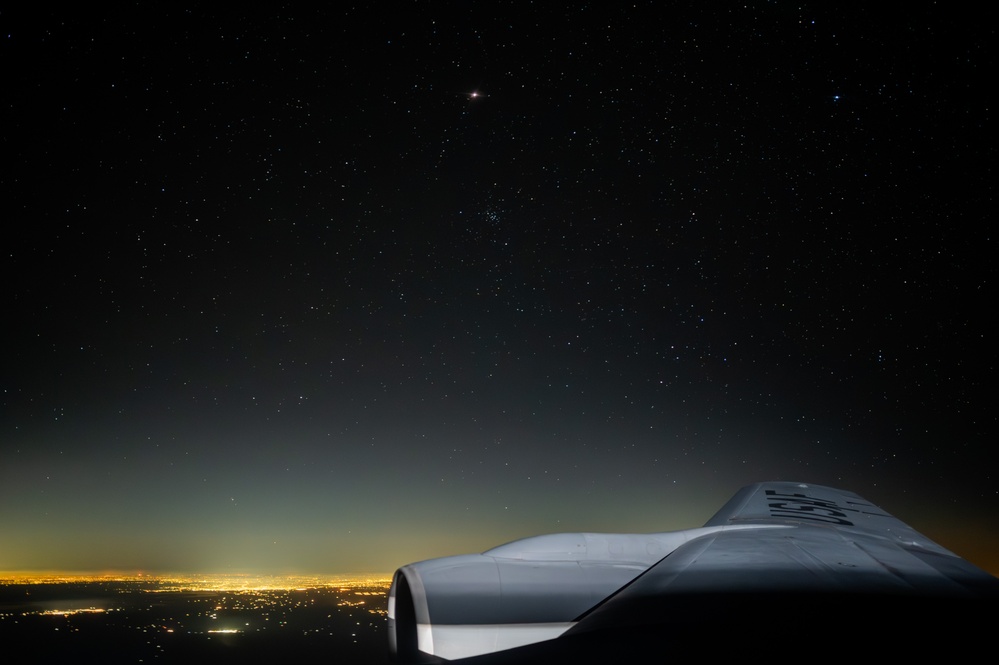 A-10 Thunderbolt II aircraft refuel with KC-135 Stratotanker at night