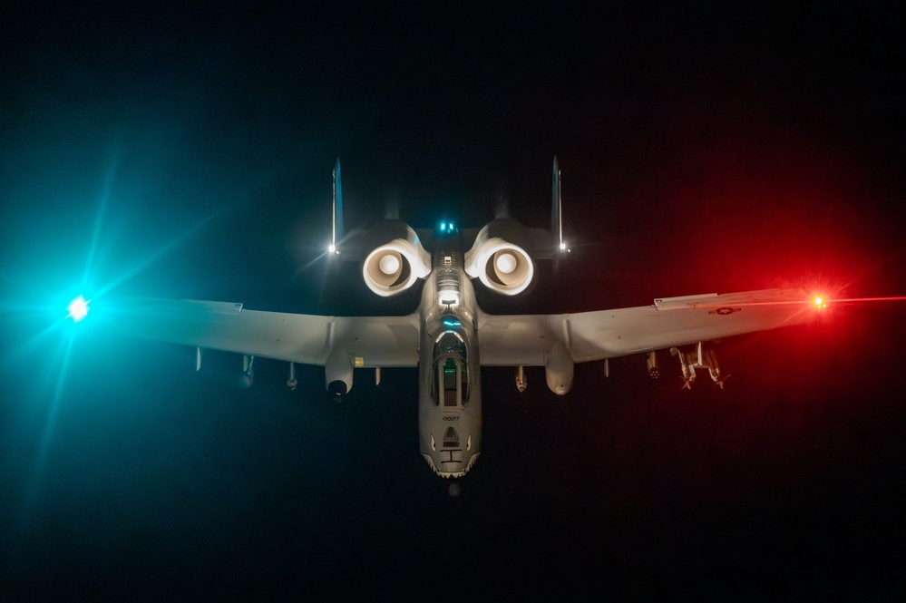 A-10 Thunderbolt II aircraft refuel with KC-135 Stratotanker at night