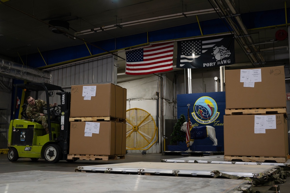 The 305th Aerial Port Squadron palletize food rations to the U.S. European Command area of operations