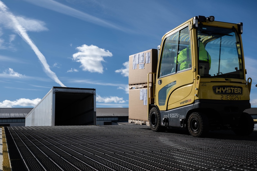 The 305th Aerial Port Squadron palletize food rations to the U.S. European Command area of operations