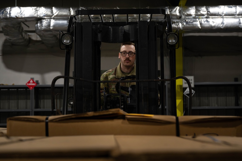 The 305th Aerial Port Squadron palletize food rations to the U.S. European Command area of operations