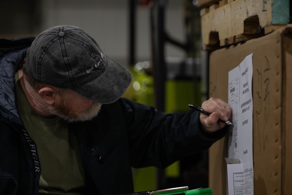 The 305th Aerial Port Squadron palletize food rations to the U.S. European Command area of operations