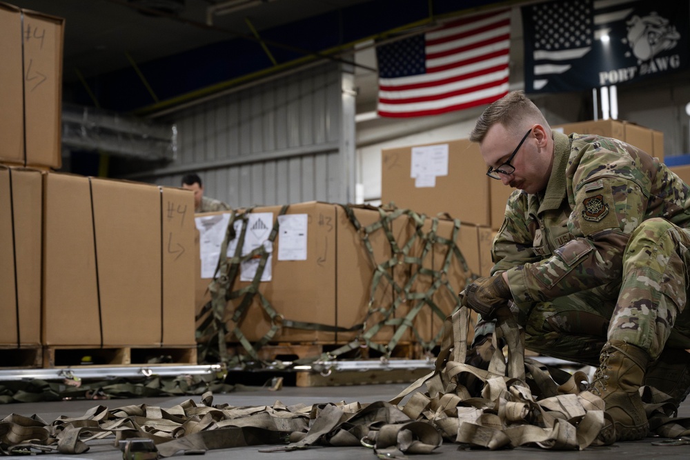 The 305th Aerial Port Squadron palletize food rations to the U.S. European Command area of operations