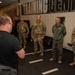 Maj. Gen. Gregory Kreuder, 19th Air Force Commander, is briefed by Justin Schwind, human performance advisor at the Human Performance and Leadership Center