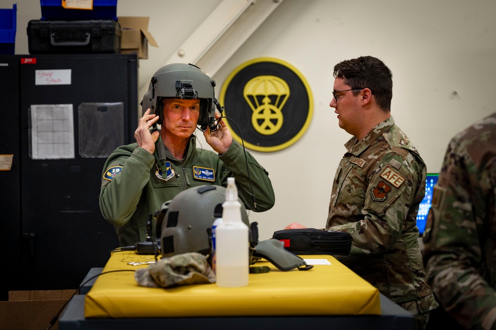 Maj. Gen. Gregory Kreuder, 19th Air Force Commander, acquired his flight equipment before flying a HH60W