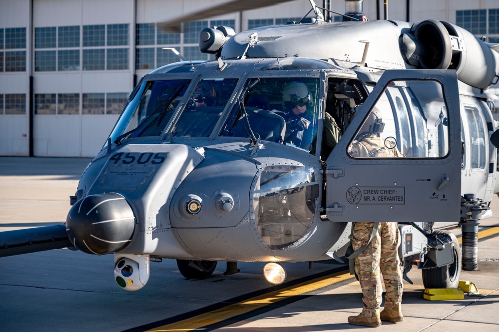 Maj. Gen. Gregory Kreuder, 19th Air Force Commander, did a preflight checklist before flying a HH60W