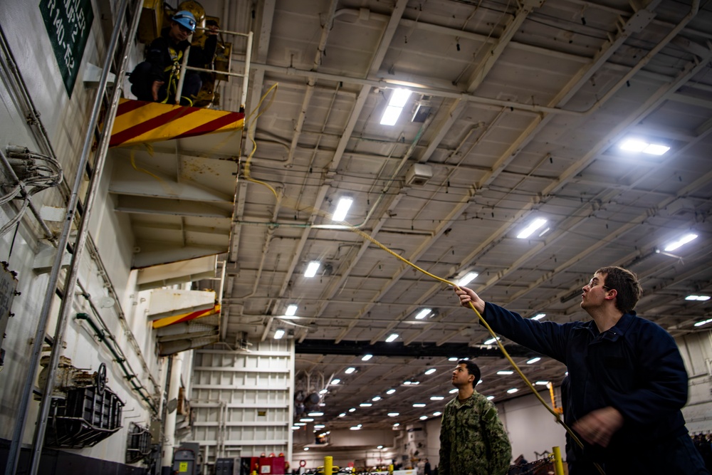 Nimitz Sailor Tosses Rope