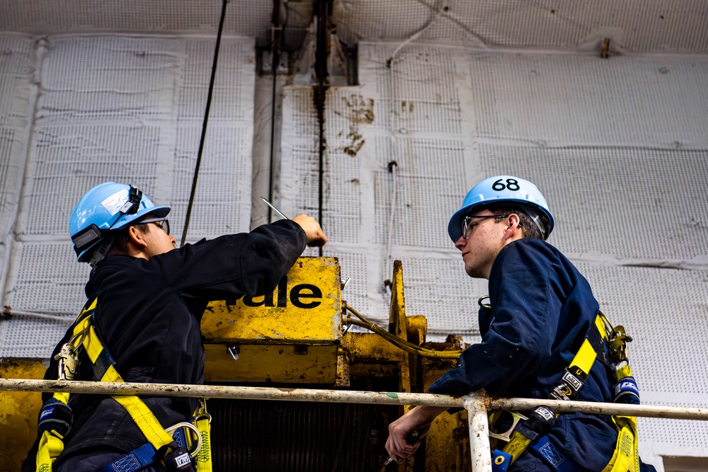 Nimitz Sailors Conduct Maintenance on a Saddle Winch