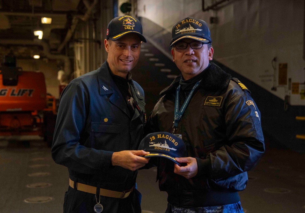 Sailors from JS Haguro (DDG 180) tour the USS America (LHA 6)