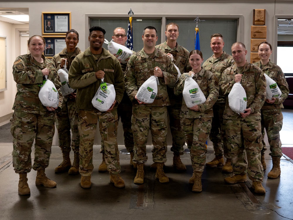 First sergeants pass out turkeys to Airmen