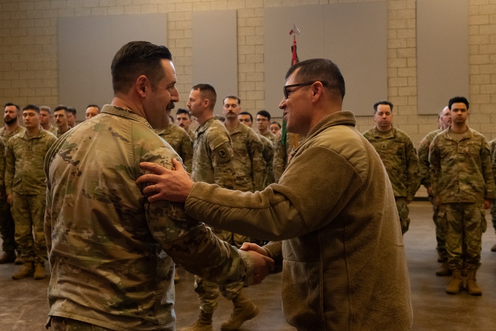 Uncasing the Colors: Washington National Guard military police detachment returns from Spartan Shield deployment.