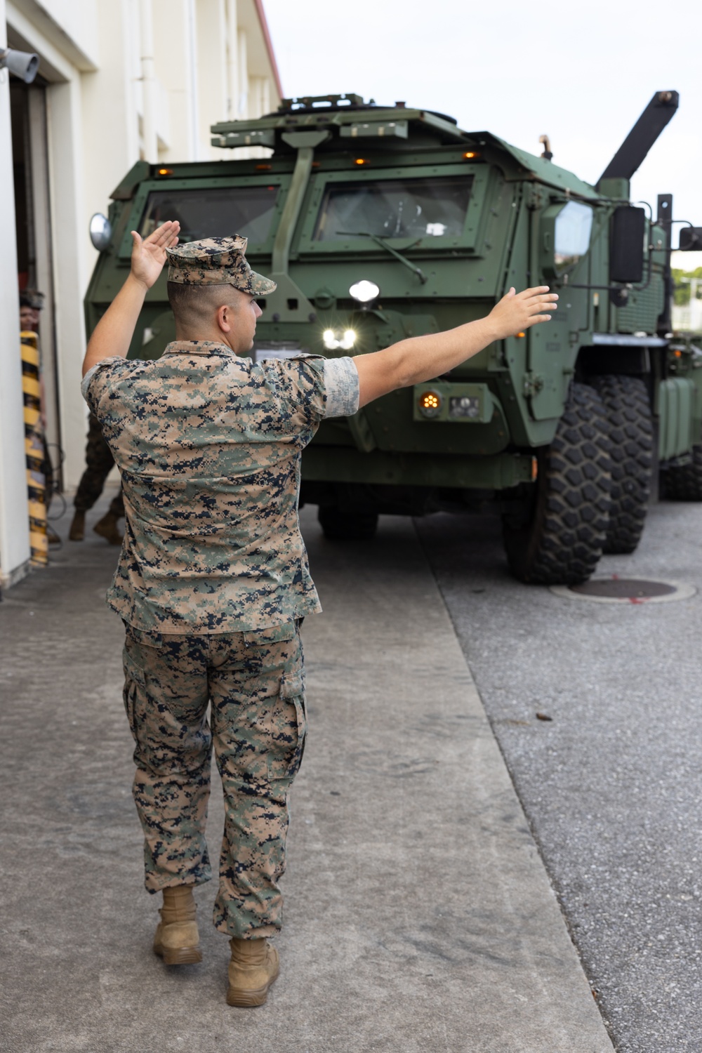 Motor transport operators prepare vehicles for mission