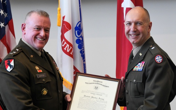 Lt. Gen. Robert Harter promotes Brig. Gen. Mitchell Wisniewski