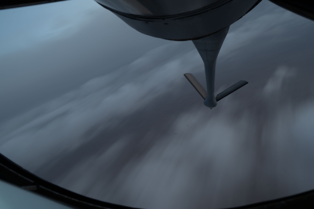 KC-135 Stratotanker conducts aerial refueling mission in stormy skies over USCENTCOM AOR