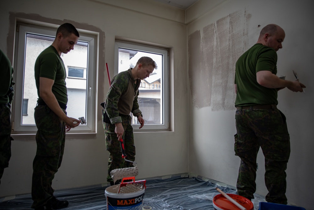 KFOR soldiers participate in a renovation project in Northern Kosovo