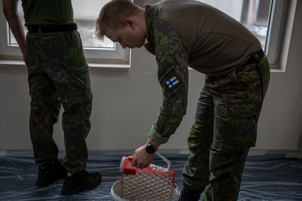 KFOR soldiers participate in a renovation project in Northern Kosovo