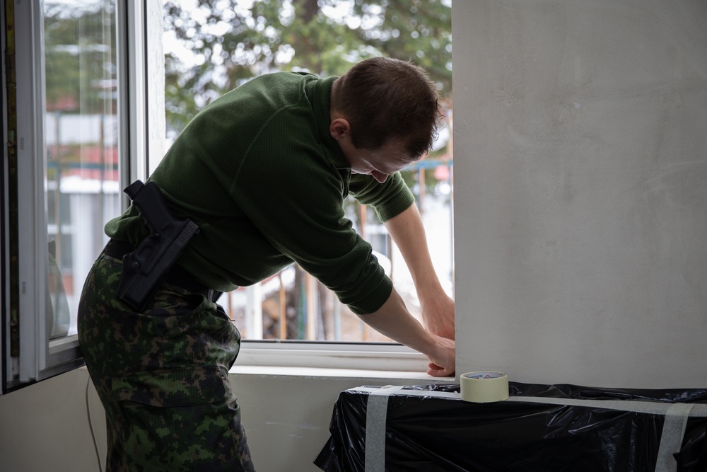 KFOR soldiers participate in a renovation project in Northern Kosovo