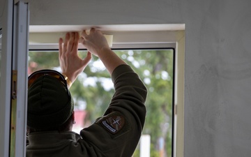 KFOR soldiers participate in a renovation project in Northern Kosovo