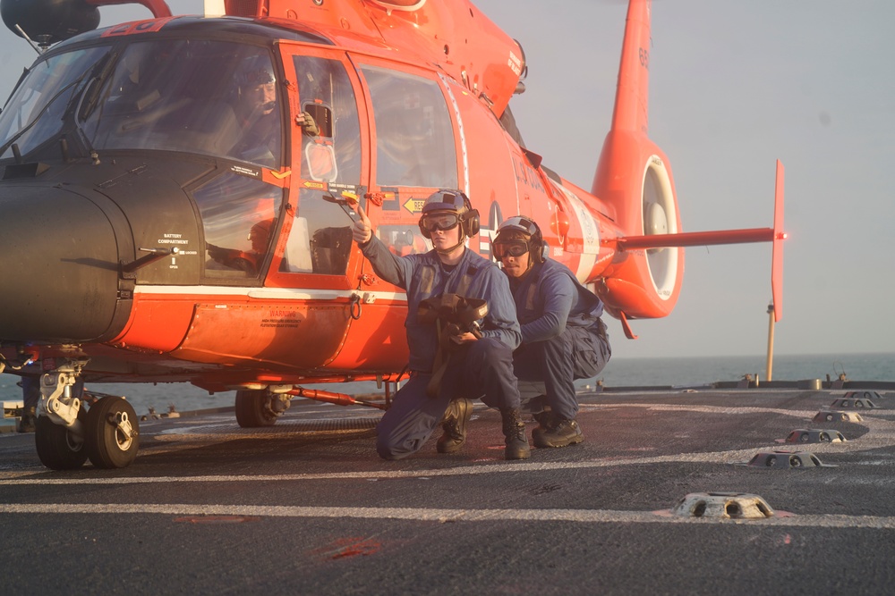 Coast Guard Cutter Venturous crew members conduct flight operations with an embarked aircrew in the Eastern Pacific Ocean