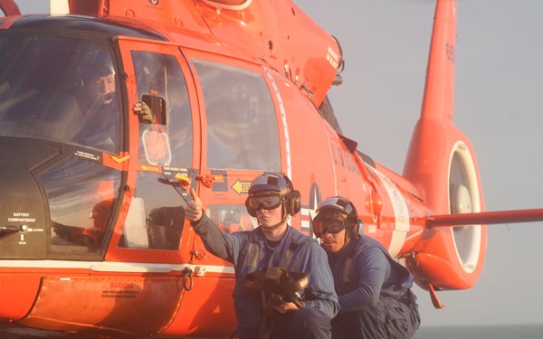 Coast Guard Cutter Venturous crew members conduct flight operations with an embarked aircrew in the Eastern Pacific Ocean