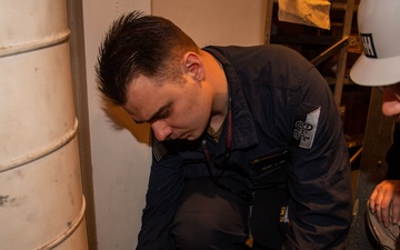 Contractors conduct equipment assessments on the USS Ronald Reagan (CVN 76)