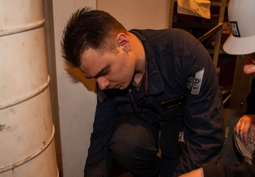 Contractors conduct equipment assessments on the USS Ronald Reagan (CVN 76)